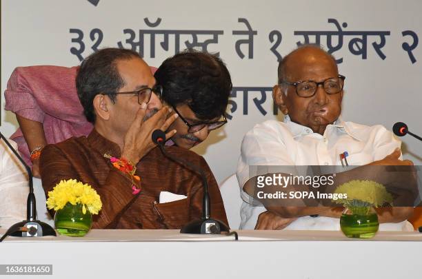 Shiv Sena chief Uddhav Thackeray speaks to Member of Parliament Sanjay Raut as Nationalist Congress Party chief Sharad Govindrao Pawar looks on...