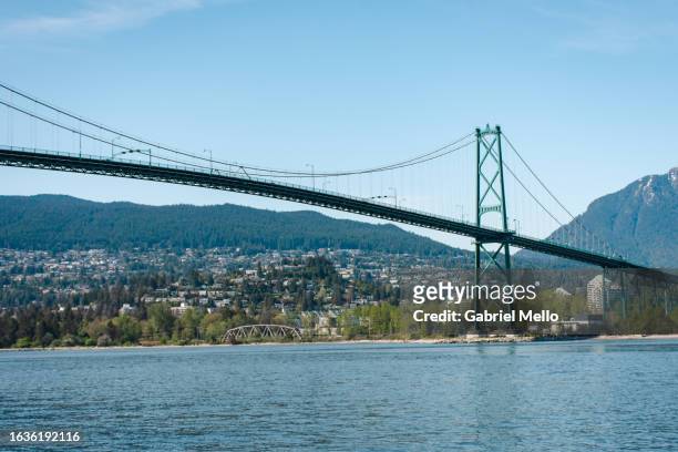 pov of lions gate bridge in vancouver - vancouver lions gate stock pictures, royalty-free photos & images