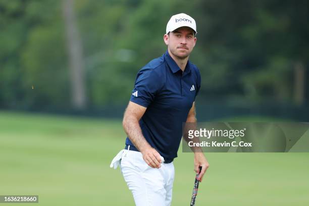 Nick Taylor of Canada reacts on the first green during the first round of the TOUR Championship at East Lake Golf Club on August 24, 2023 in Atlanta,...