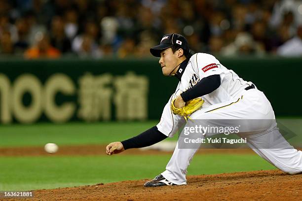 Kazuhisa Makita of Team Japan pitches in the ninth inning during Pool 1, Game 6 between the Netherlands and Japan in the second round of the 2013...