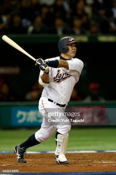 Shinnosuke Abe hits a home run in the bottom of second inning during Pool 1, Game 6 between the Netherlands and Japan in the second round of the 2013...