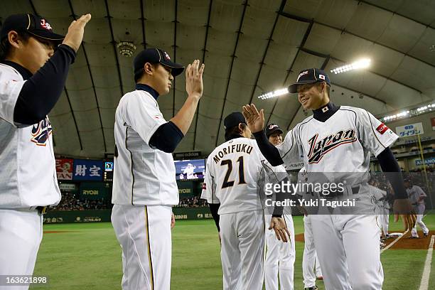Takashi Toritani of Team Japan greets his teammates during player introductions before Pool 1, Game 6 between the Netherlands and Japan in the second...