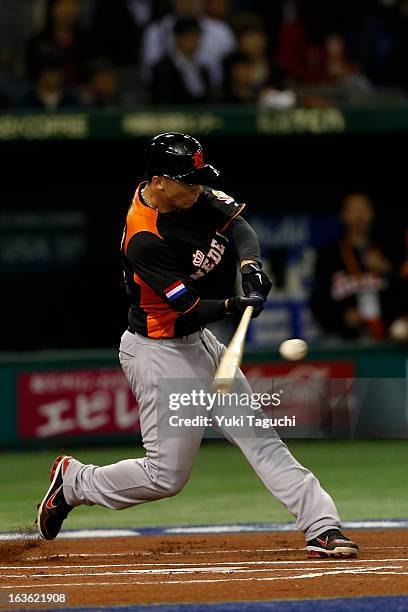 Andrelton Simmons of Team Netherlands hits a home run in the top of the first inning during Pool 1, Game 6 between the Netherlands and Japan in the...