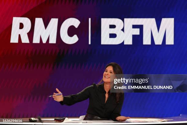 French BFM TV news channel host and journalist Apolline de Malherbe gestures during a broadcast television show on the new BFM TV television set in...