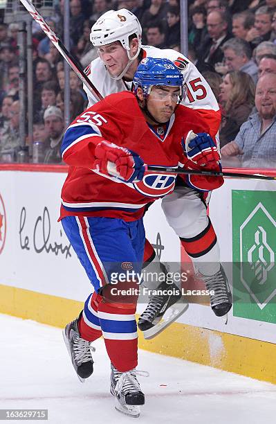 Francis Bouillon of the Montreal Canadiens collides with Zack Smith of the Ottawa Senators during the NHL game on March 13, 2013 at the Bell Centre...