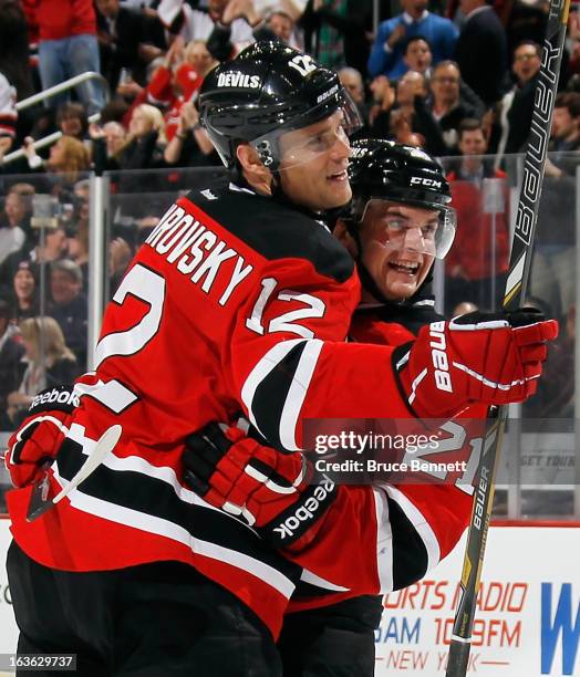 Andrei Loktionov of the New Jersey Devils celebrates his goal against the Philadelphia Flyers along with Alexei Ponikarovsky at 6:31 of the second...