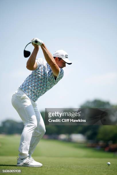 Viktor Hovland of Norway plays his shot from the first tee during the first round of the TOUR Championship at East Lake Golf Club on August 24, 2023...