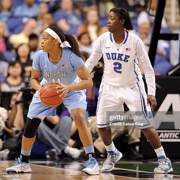 Brittany Rountree of the North Carolina Tar Heels controls the ball against Alexis Jones of the Duke Blue Devils during the finals of the 2013...