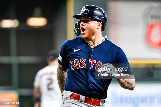 Alex Verdugo of the Boston Red Sox celebrates after hitting a solo home run in the first inning against the Houston Astros at Minute Maid Park on...