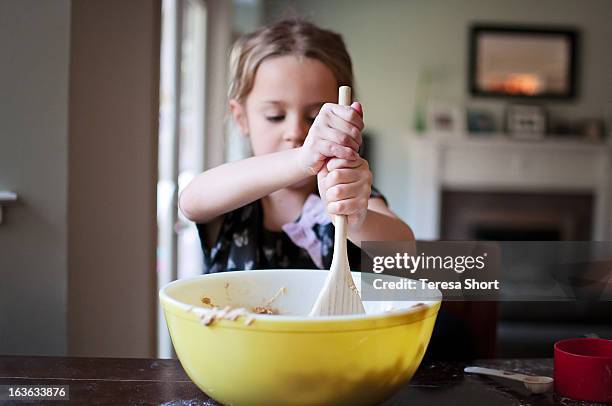 girl baking and mixing - girl baking stock pictures, royalty-free photos & images