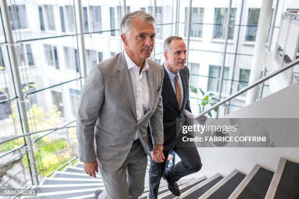 Chief Executive Sergio Ermotti and UBS CFO Todd Tuckner arrive for a press conference on the first results of the Swiss giant banking UBS since it's...