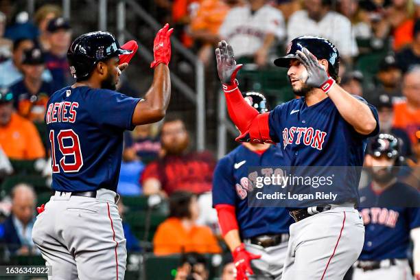 Wilyer Abreu celebrates with Pablo Reyes of the Boston Red Sox after hitting a two-run home run in the second inning against the Houston Astros at...