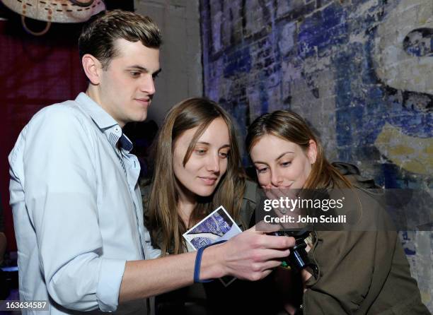 Producer Emma Ludbrook checks out the Samsung Galaxy Camera at the Samsung Galaxy "Artifact" after party at SXSW on March 13, 2013 in Austin, Texas.