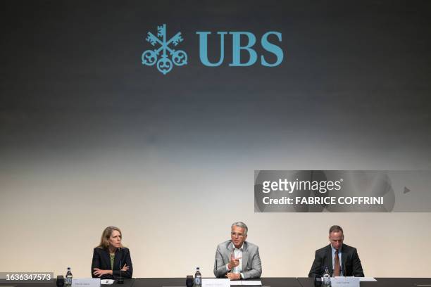 Head of communications Marsha Askins, UBS chief executive Sergio Ermotti and UBS CFO Todd Tuckner give a press conference on the first results of the...