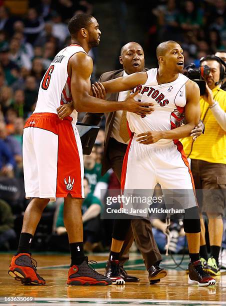Sebastian Telfair of the Toronto Raptors is held back by teammates and coaches after being thrown out of the game for arguing with referee Kenny...