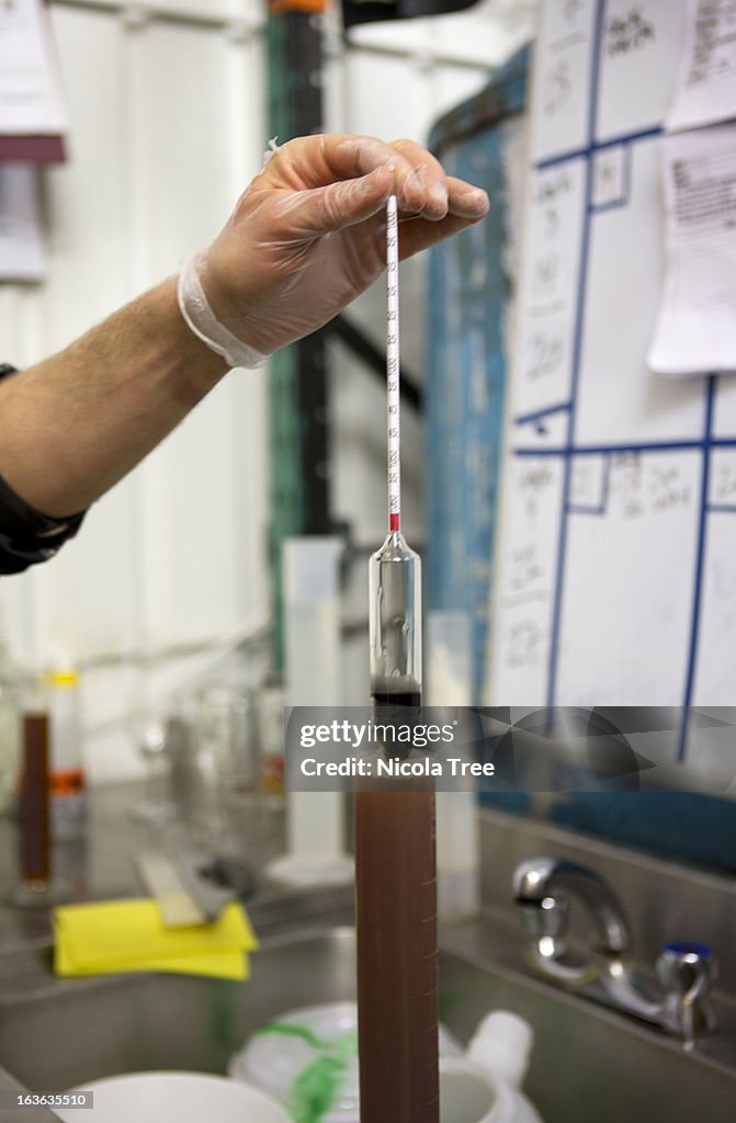 Testing the density of beer in a micro brewery