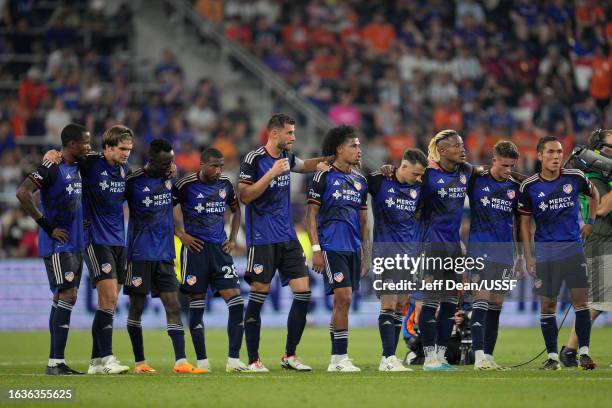Cincinnati players stand during a penalty shootout in a U.S. Open Cup semifinal match against Inter Miami at TQL Stadium on August 23, 2023 in...