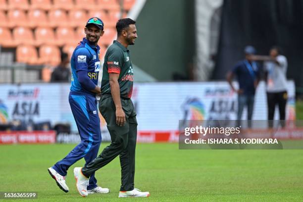 Sri Lanka's captain Dasun Shanaka and Bangladesh's captain Shakib Al Hasan gesture before the start of the Asia Cup 2023 one-day international...