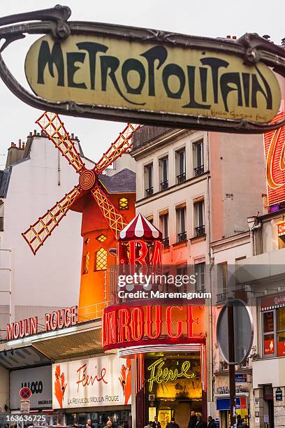 pigalle, the underground sign and the moulin rouge - the place pigalle in paris stock pictures, royalty-free photos & images