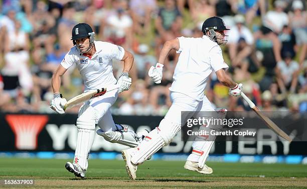 Nick Compton and Jonathan Trott run between the wickets during day one of the 2nd Test match between New Zealand and England at Basin Reserve on...