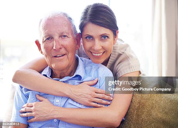 showing her father how much she cares - hugging a chair stock pictures, royalty-free photos & images