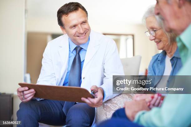 you have nothing to worry about - healthcare - married doctor stock pictures, royalty-free photos & images