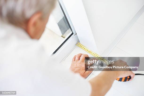 man taking measurements of the floor - measure length stock pictures, royalty-free photos & images
