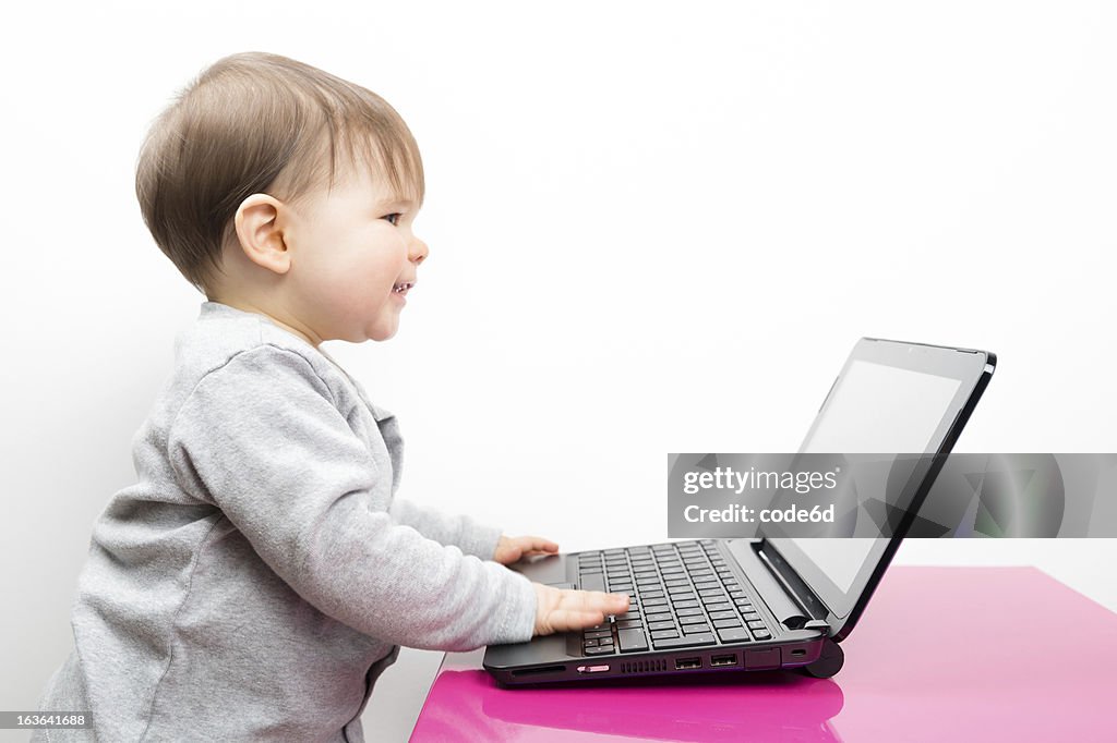 Workload Computer Baby Smiling Baby Girl Using A Laptop Computer High-Res Stock Photo - Getty ...