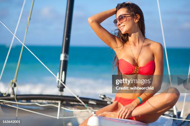 beautiful woman on boat in the sea - beautiful beach babes stock pictures, royalty-free photos & images