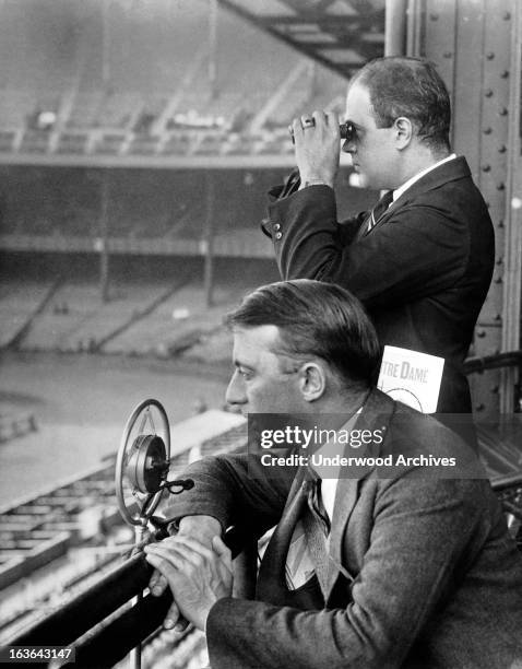 Radio sports announcers broadcasting a Notre Dame football game, circa 1930.