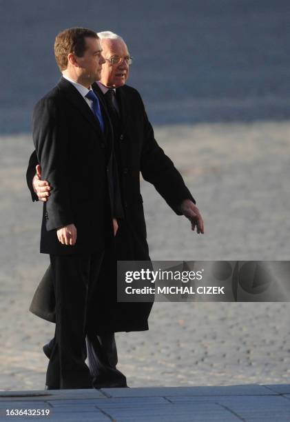 Czech President Vaclav Klaus welcomes Russian President Dmitry Medvedev on December 8, 2011 at the Prague Castle. AFP PHOTO / MICHAL CIZEK