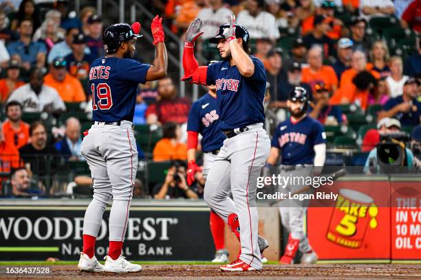 Wilyer Abreu celebrates with Pablo Reyes of the Boston Red Sox after hitting a two-run home run in the second inning against the Houston Astros at...