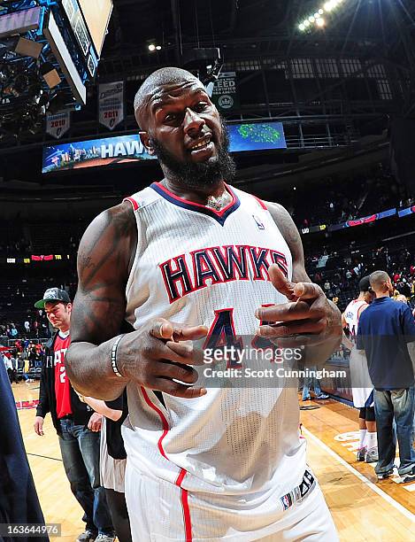 Ivan Johnson of the Atlanta Hawks smiles for the camera after the game against the Los Angeles Lakers on March 13, 2013 at Philips Arena in Atlanta,...