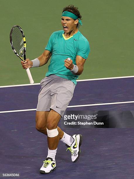 Rafael Nadal of Spain celebrates after match point against Ernests Gulbis of Latvia during day 8 of the BNP Paribas Open at Indian Wells Tennis...