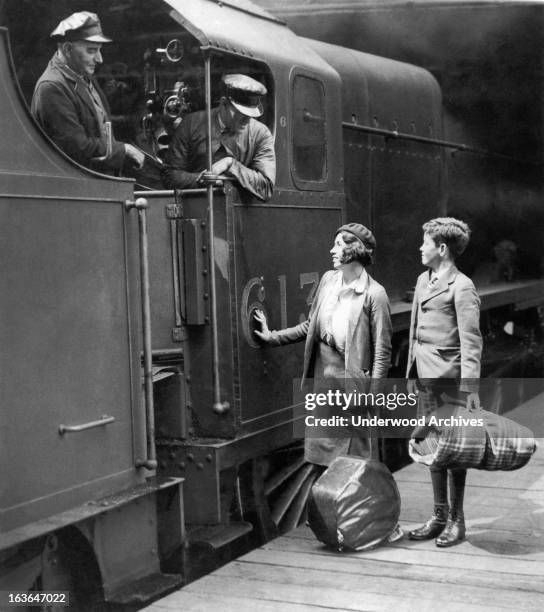 Two orphaned youngsters have traveled from Australia to England, and are now preparing to board the train at Euston Station that will take them to...