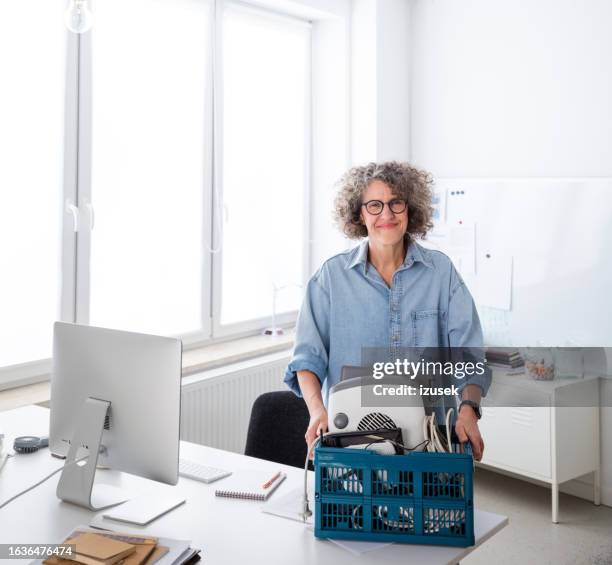 woman collecting electronic waste in the office - e waste stock pictures, royalty-free photos & images