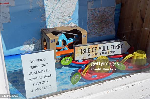 Signs in a shop window in Tobermory highlighting the difficulties faced by islanders due to disruption to CalMac ferry services, on August 30, 2023...