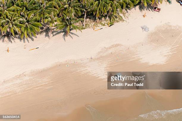 aerial view of sandy beach and small tuktuk, sanya, hainan, china - sanya stock-fotos und bilder