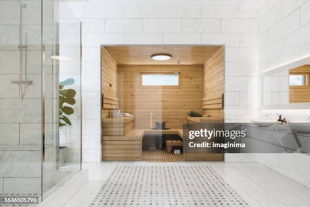 wooden sauna in luxury modern bathroom - sauna stock pictures, royalty-free photos & images