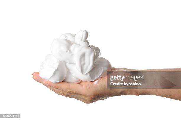 shaving foam on the hand against white background - shaving cream stockfoto's en -beelden