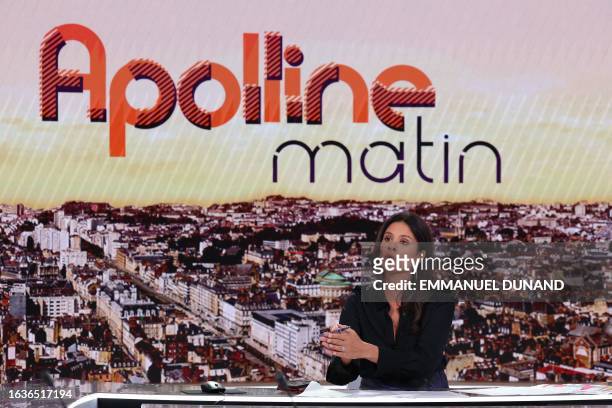 French BFM TV news channel host and journalist Apolline de Malherbe gestures during a broadcast television show on the new BFM TV television set in...