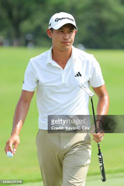 Collin Morikawa of the United States reacts to his birdie on the 17th green during the first round of the TOUR Championship at East Lake Golf Club on...