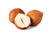 2 whole hazelnuts and 1 half hazelnut on a white background