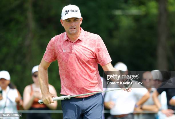 Keegan Bradley of the United States lines up a putt on the first green during the first round of the TOUR Championship at East Lake Golf Club on...