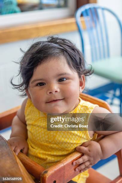 baby girl at table - christa stock pictures, royalty-free photos & images