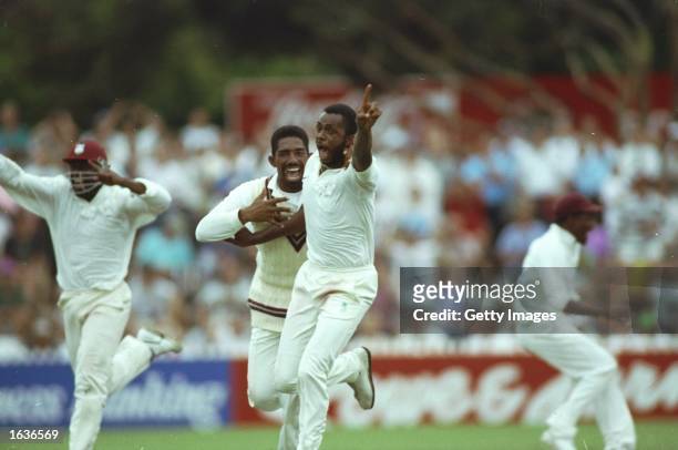 Courtney Walsh of the West Indies celebrates their historic victory during the Fourth Test match against Australia in at the Adelaide Oval in...
