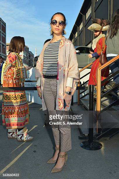 Fashion week guest wearing Valentino shoes, Cos top, Zara pants and Fendi bag is seen during Mercedes-Benz Fashion Week Istanbul Fall/Winter 2013/14...