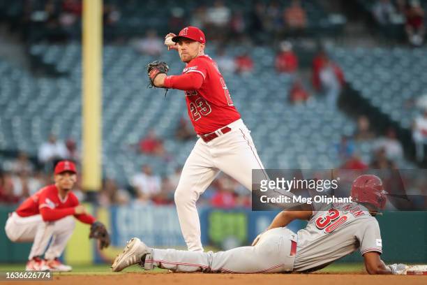Brandon Drury of the Los Angeles Angels throws to first base in the second inning against the Cincinnati Reds at Angel Stadium of Anaheim on August...