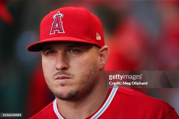 Mike Trout of the Los Angeles Angels looks on from the dugout ahead of the game against the Cincinnati Reds at Angel Stadium of Anaheim on August 22,...
