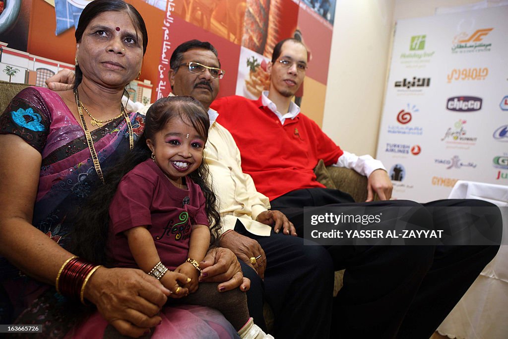 Indian Jyoti Amge the world's shortest woman sits with her parents ...